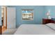 Comfortable bedroom with water view and ample natural light at 12038 Steppingstone Blvd, Tampa, FL 33635