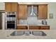 Modern kitchen with stainless steel appliances and attractive backsplash at 12038 Steppingstone Blvd, Tampa, FL 33635