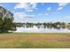 Serene lake view with fountain and lush landscaping at 12038 Steppingstone Blvd, Tampa, FL 33635