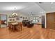 Open concept living and dining area with hardwood floors at 12038 Steppingstone Blvd, Tampa, FL 33635