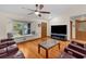 Open living room featuring hardwood floors and a built-in window seat at 12038 Steppingstone Blvd, Tampa, FL 33635