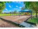 Community playground with shaded area at 12038 Steppingstone Blvd, Tampa, FL 33635