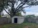 Fenced backyard with mature tree, shed and lawn space at 2716 49Th S St, Gulfport, FL 33707