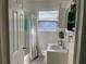 Cozy bathroom featuring a tub-shower combo and single sink vanity with colorful accents at 2716 49Th S St, Gulfport, FL 33707