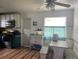 Eat-in kitchen features wood flooring, an oven, microwave, and built-in breakfast nook at 2716 49Th S St, Gulfport, FL 33707