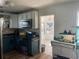 Traditional kitchen with white upper cabinets and a breakfast nook off the side at 2716 49Th S St, Gulfport, FL 33707