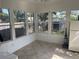 Enclosed porch or sunroom with tiled floors, many windows, and white walls at 2716 49Th S St, Gulfport, FL 33707