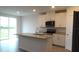 Modern kitchen featuring white cabinets, granite countertops, and stainless steel appliances at 31693 Wild Grape Lane, Brooksville, FL 34602