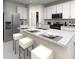 Modern kitchen featuring stainless steel appliances and an island at 31693 Wild Grape Lane, Brooksville, FL 34602