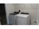 Laundry room with Whirlpool washer and dryer at 31693 Wild Grape Lane, Brooksville, FL 34602