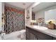 Bathroom featuring vanity with granite countertop and patterned shower curtain at 724 Royal Empress Dr, Ruskin, FL 33570