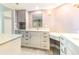 Spa-like bathroom with double vanity, marble countertop, and corner makeup vanity at 736 Island Way # 606, Clearwater Beach, FL 33767