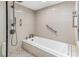 Bathroom with soaking tub, walk-in shower, and patterned tile floor at 736 Island Way # 606, Clearwater Beach, FL 33767
