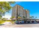 Multi-story condominium building with parking and landscaping at 736 Island Way # 606, Clearwater Beach, FL 33767