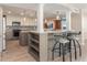 Open concept kitchen with breakfast bar and modern finishes at 736 Island Way # 606, Clearwater Beach, FL 33767