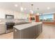 Modern kitchen with island, stainless steel appliances, and water view at 736 Island Way # 606, Clearwater Beach, FL 33767