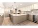 U-shaped kitchen with quartz countertops and custom cabinetry at 736 Island Way # 606, Clearwater Beach, FL 33767