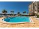 Resort-style pool with lounge chairs and waterfront views at 736 Island Way # 606, Clearwater Beach, FL 33767