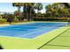 Well-maintained tennis court with green and blue surface, ready for play at 736 Island Way # 606, Clearwater Beach, FL 33767