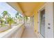 Private balcony with views of the neighborhood and palm trees at 924 Bunker View Dr, Apollo Beach, FL 33572