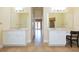 Spa-like bathroom with double vanities and access to other rooms at 924 Bunker View Dr, Apollo Beach, FL 33572