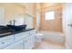 Bathroom features a blue vessel sink and shower/tub combo at 924 Bunker View Dr, Apollo Beach, FL 33572