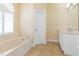 Bathroom boasts double vanity and a soaking tub at 924 Bunker View Dr, Apollo Beach, FL 33572