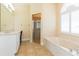 Elegant bathroom with double vanity and soaking tub at 924 Bunker View Dr, Apollo Beach, FL 33572