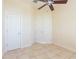 Spacious bedroom with tiled floors and double door closet at 924 Bunker View Dr, Apollo Beach, FL 33572
