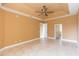 Spacious bedroom with tile floors and ceiling fan at 924 Bunker View Dr, Apollo Beach, FL 33572