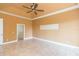 Bright bedroom featuring tile floors and a ceiling fan at 924 Bunker View Dr, Apollo Beach, FL 33572