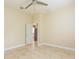 Simple bedroom with tile floors and access to kitchen at 924 Bunker View Dr, Apollo Beach, FL 33572