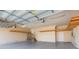 Two-car garage with built-in shelving and extra storage at 924 Bunker View Dr, Apollo Beach, FL 33572