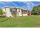 Single-story home with a screened porch and landscaped yard at 924 Bunker View Dr, Apollo Beach, FL 33572