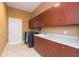 Laundry room features ample cabinetry and space for a washer and dryer at 924 Bunker View Dr, Apollo Beach, FL 33572