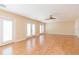 Spacious living room with hardwood floors and multiple access points at 924 Bunker View Dr, Apollo Beach, FL 33572