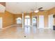 Open living room with tile floors, two ceiling fans and an open floor plan at 924 Bunker View Dr, Apollo Beach, FL 33572
