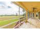 Spacious screened porch overlooking a lush green landscape at 924 Bunker View Dr, Apollo Beach, FL 33572