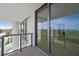 Private balcony with glass railings and distant city views at 301 1St S St # 205, St Petersburg, FL 33701