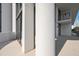 Modern balcony with glass railings and white columns at 301 1St S St # 205, St Petersburg, FL 33701