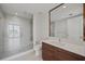 Modern bathroom with a large walk-in shower and floating vanity at 301 1St S St # 205, St Petersburg, FL 33701