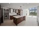 Modern kitchen with island, stainless steel appliances, and laundry closet at 301 1St S St # 205, St Petersburg, FL 33701