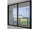 Sliding glass doors offer stunning views of a stadium and cityscape at 301 1St S St # 205, St Petersburg, FL 33701