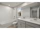 Modern bathroom with double vanity, soaking tub, and tile flooring at 31472 Woodland Race Loop, Wesley Chapel, FL 33545