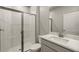 Clean bathroom featuring a shower and updated vanity at 31472 Woodland Race Loop, Wesley Chapel, FL 33545