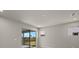 Bright bedroom with sliding glass doors leading to a private patio at 31472 Woodland Race Loop, Wesley Chapel, FL 33545