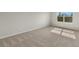 Bright bedroom with carpet and large window at 31472 Woodland Race Loop, Wesley Chapel, FL 33545