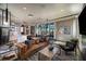 Relaxing community room with leather sofa and chairs at 31472 Woodland Race Loop, Wesley Chapel, FL 33545