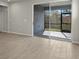 Living area with sliding glass doors leading to a screened patio at 31472 Woodland Race Loop, Wesley Chapel, FL 33545