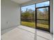 Spacious screened patio overlooking a grassy backyard at 31472 Woodland Race Loop, Wesley Chapel, FL 33545